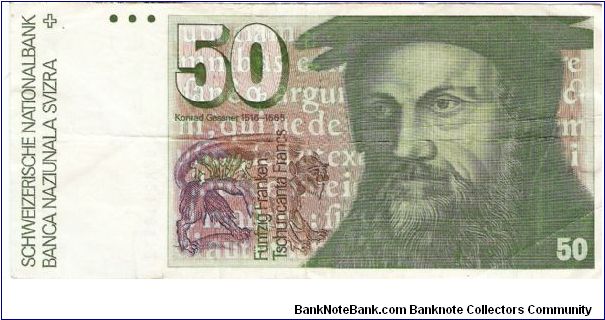 50 Franken.

Format: 159x74mm

Konrad Gessner on face; eagle owl, Primula auricu-la plant and stars on vertical format on back.

Pick #56h Banknote