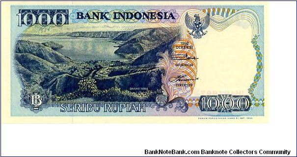 1000 Rupiah 
Blue/Purple
Danau Toba Hills & lake
Nias warrior leaping traditional stone, Lompat batu pulau nias
Wtmrk Woman Banknote