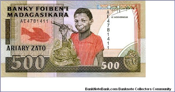500 Francs
Brown/Red/Green
Fish, Boy with fish in net & sea shell
Aerial view of port   
Security thread
Wtmrk Zebu's head Banknote