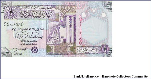 1/2 DINAR

54 253030

P # 63 Banknote