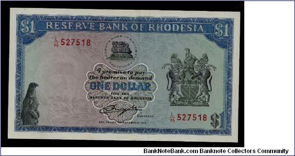 Reserve Bank of Rhodesia One Dollar, # L/95 527518 in Aunc condition; one barely noticeable vertical/center fold, crisp and clean condition with beautiful artwork and printing. P-30b Banknote