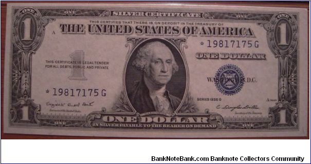 1935 G $1 silver certificate (good for one dollar of silver when redeemed) - STAR note (replacement for error notes) - signatures of Smith and Dillon - with motto variety (has In God We Trust on reverse) - Friedberg # 1617*, 1,080,000 star notes printed. Certified Choice Uncirculated 64 with Exceptional Paper Quality by Paper Money Guarantee. Banknote
