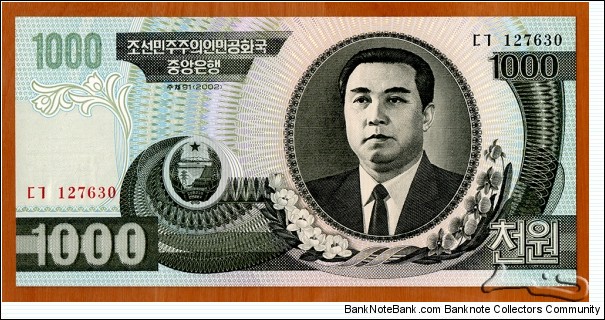 North Korea | 
1,000 Wŏn, 2002 | 

Obverse: Portrait of Kim Il-sung, and Siebold's Magnolia (Magnolia sieboldii) flowers | 
Reverse: Mangyongdae - the birthplace of Kim Il-sung | 
Watermark: Arch of Triumph in Pyongyang | Banknote