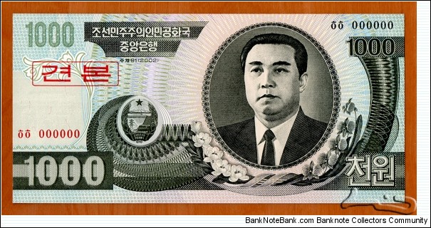 North Korea | 
1,000 Wŏn, 2002 – Speciemen | 

Obverse: Portrait of Kim Il-sung, and Siebold's Magnolia (Magnolia sieboldii) flowers | 
Reverse: Mangyongdae - the birthplace of Kim Il-sung | 
Watermark: Arch of Triumph in Pyongyang | Banknote