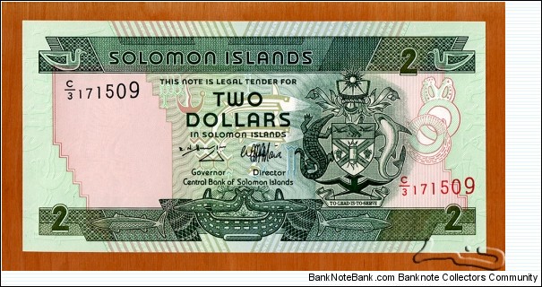 Solomon Islands | 2 Dollars, 1997 | Obverse: National Coat of Arms, Stylised Bonito fish, Food bowl with two porpoises, and Bokolo - stylised bird used as money | Reverse: Spearfishing scene | Banknote