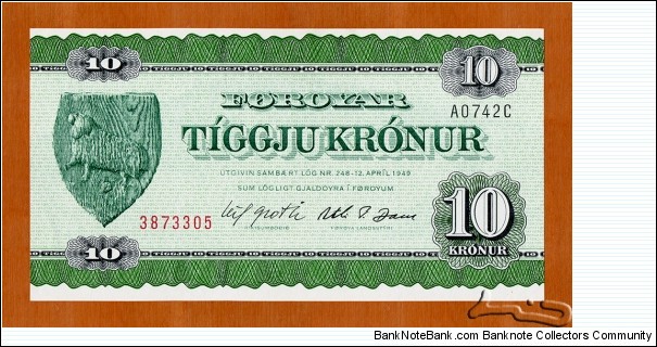 Faroe Islands | 
10 Krónur, 1974 | 

Obverse: Wooden National Coat of Arms | 
Reverse: Rural homestead | 
Watermark: Anchor chain | Banknote