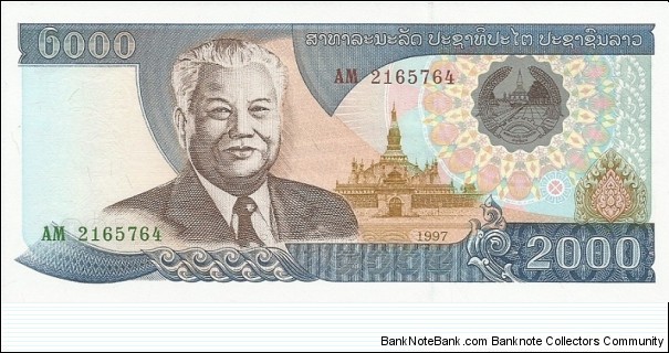 Obverse:  Text in Laotian.  Kaysone Phomvihane (13 December 1920 – 21 November 1992), first leader of the Communist Lao People's Revolutionary Party from 1955 until his death in 1992.   Served as the first Prime Minister of the Lao People's Democratic Republic from 1975 to 1991 and then as the second President from 1991 to 1992, at left.   Coat of arms at upper right.  Pha That Luang pagoda in Vientiane in underprint at center right.  Numbering in red and green.  No signatures.
Reverse:  Text in Laotian.  Hydroelectric complex at center. Banknote
