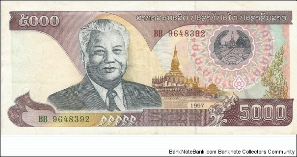 Obverse:  Text in Laotian.  Kaysone Phomvihane (13 December 1920 – 21 November 1992), first leader of the Communist Lao People's Revolutionary Party from 1955 until his death in 1992.   Served as the first Prime Minister of the Lao People's Democratic Republic from 1975 to 1991 and then as the second President from 1991 to 1992, at left.  Coat of arms at upper right. Wat That Luang stupa in Vientiane in underprint at center right.  Numbering in red and black. No signatures.
Reverse:  Text in Laotian.  Cement factory at center.   Banknote